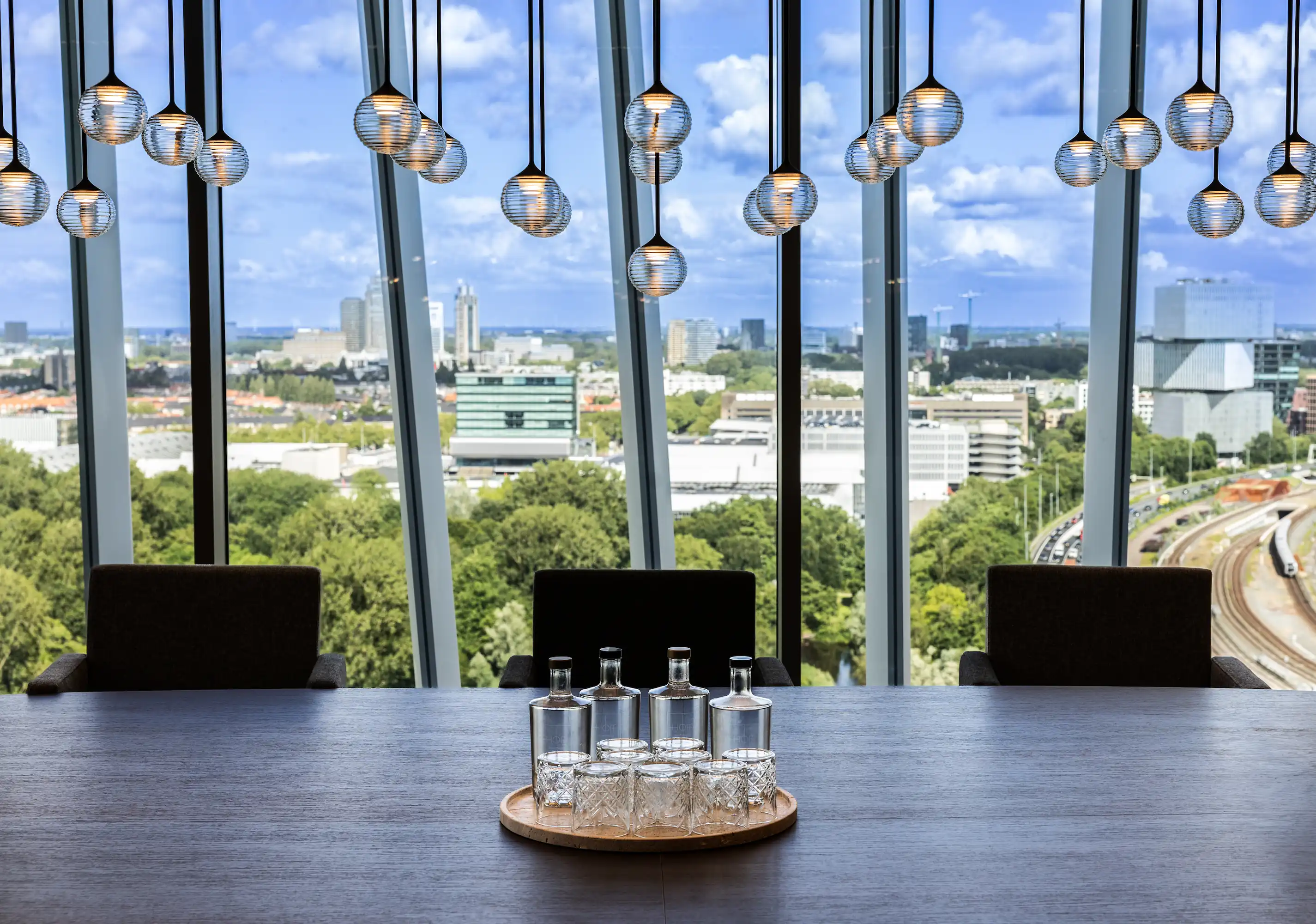 Water selection on a table overlooking Amsterdam